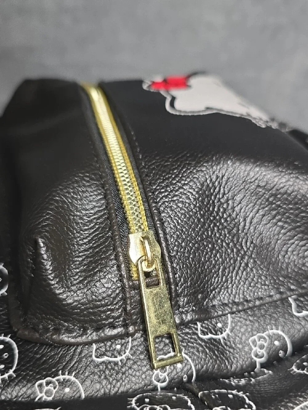 Sanrio Hello Kitty Black Backpack with Red Bow and Gold Accent